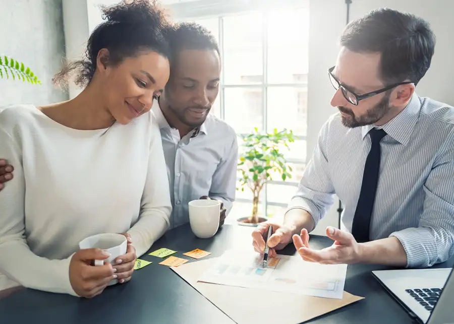Global Credit - professional helping young couple understand their credit - St. Louis, Missouri